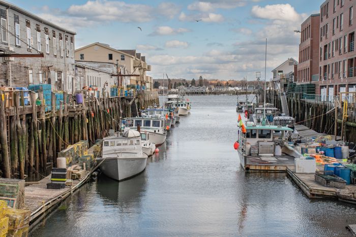 Fishing boats docked along the Old Port waterfront in Portland, Maine